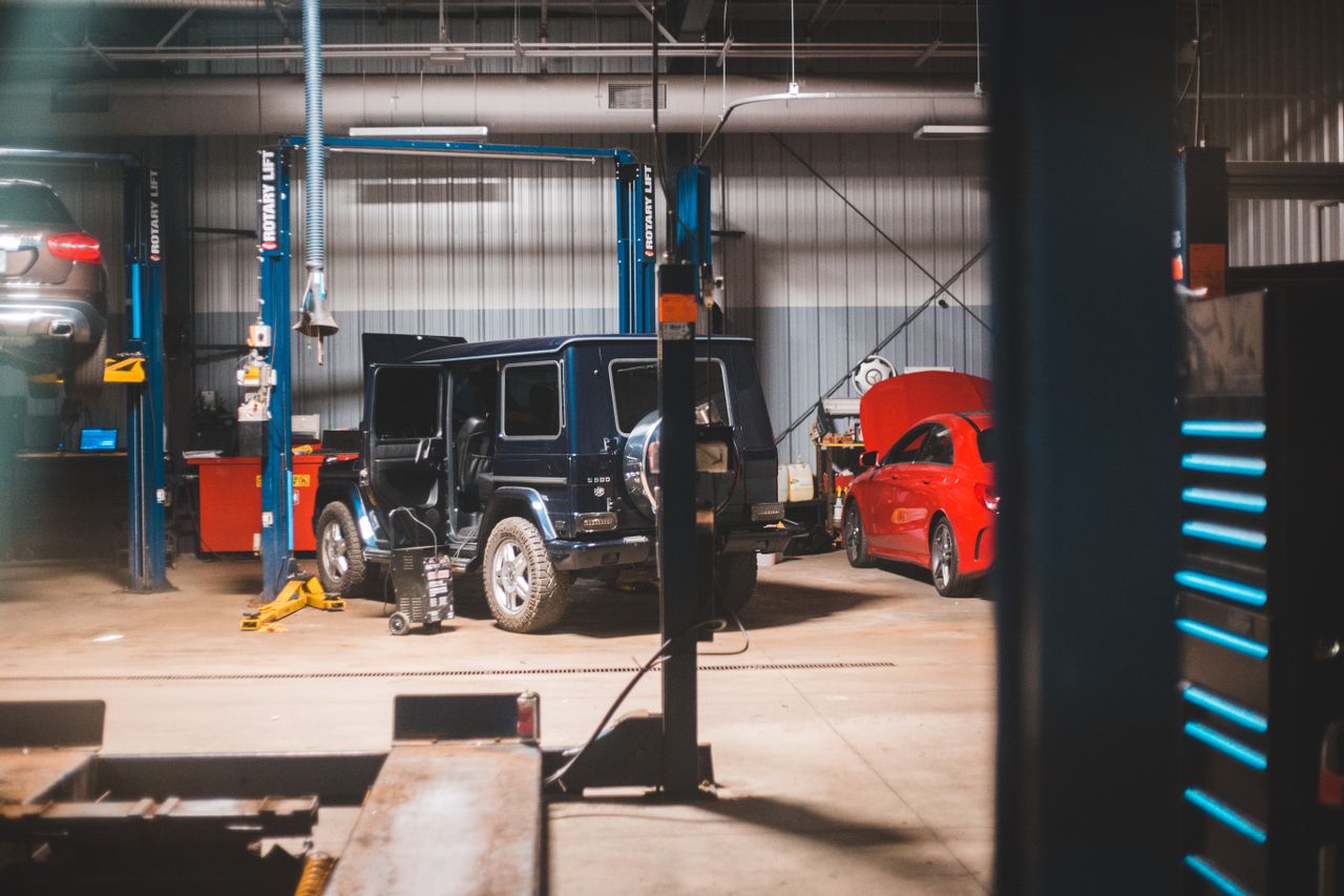 Interior of spacious car service with different metal equipment and details for repairing vehicles